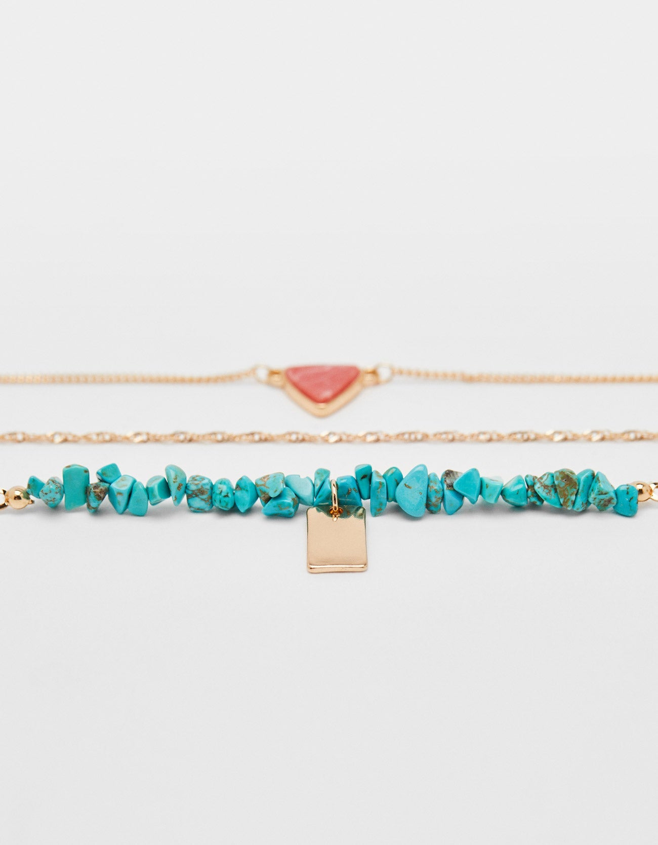 Set of necklaces with stone motifs